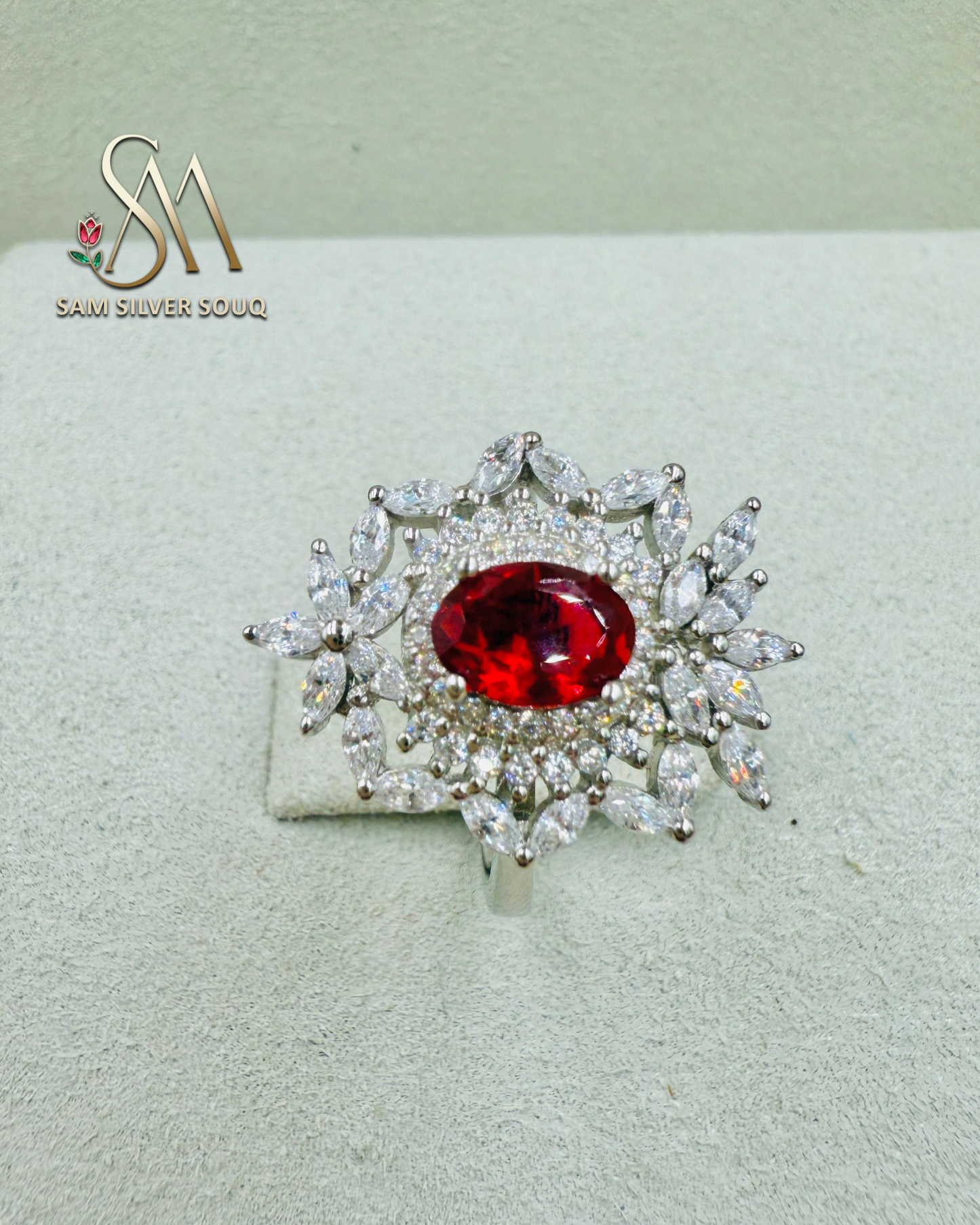 SILVER RING WITH RED COLORED STONE