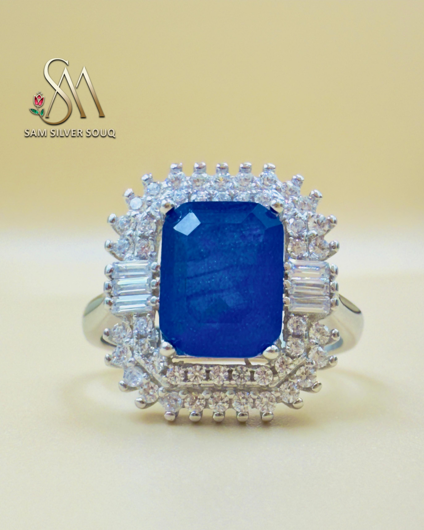 SILVER RING WITH BLUE COLORED STONE