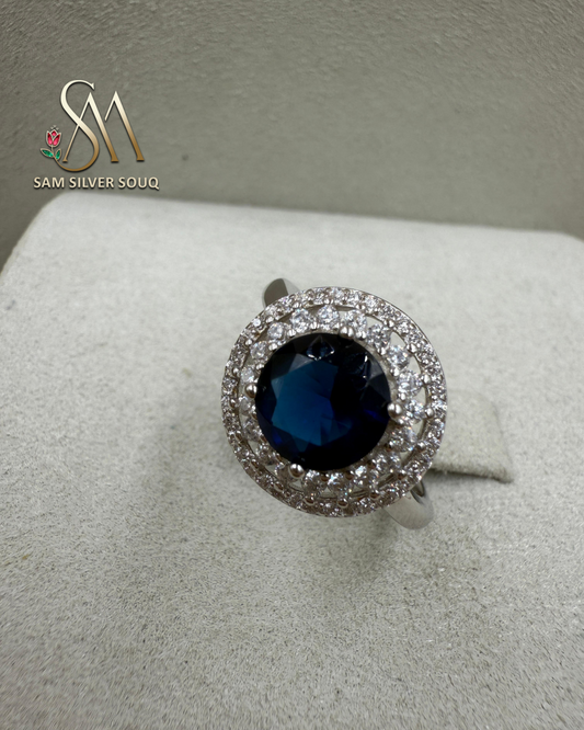 SIVLER RING WITH DARK BLUE COLORED STONE