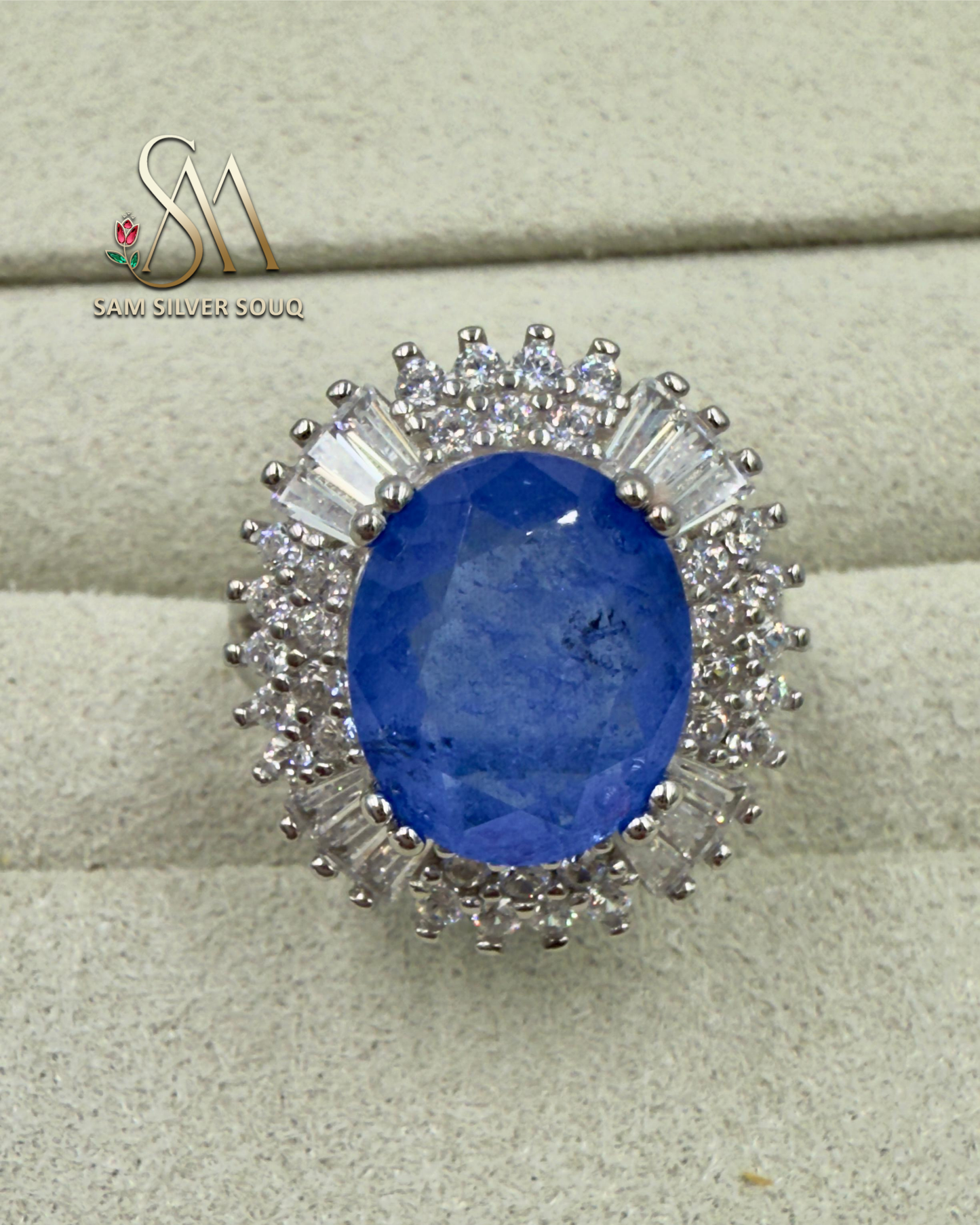 SILVER RING WITH BLUE COLORED STONE