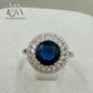 SIVLER RING WITH DARK BLUE COLORED STONE